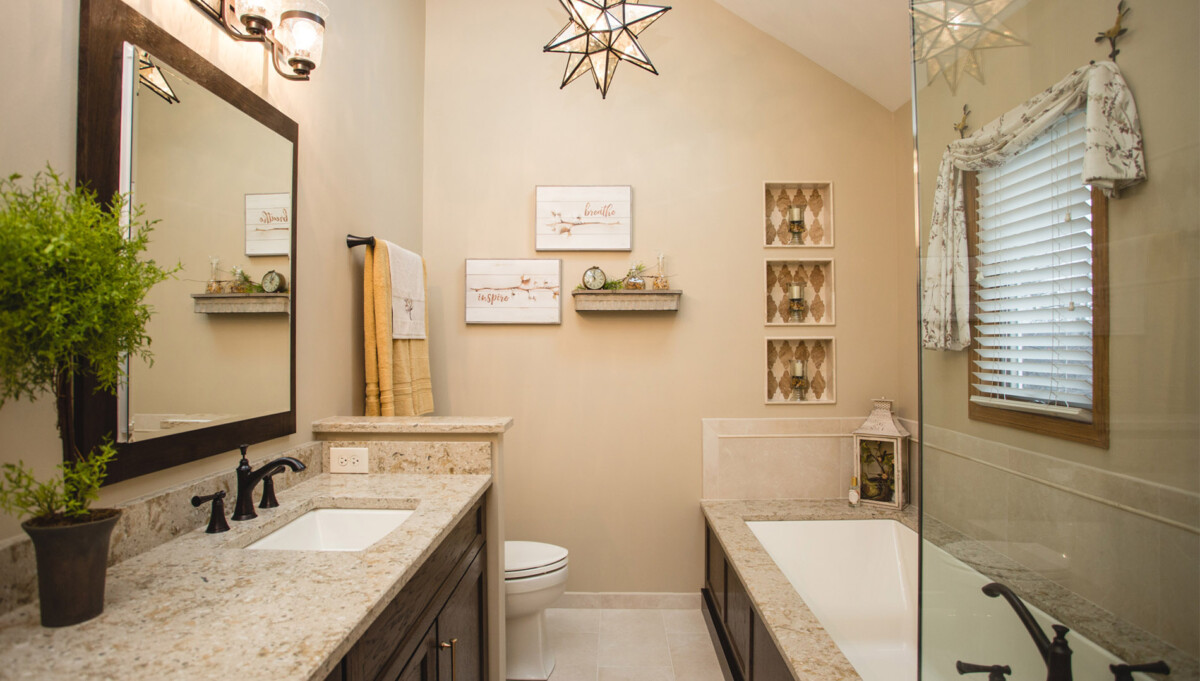 Overall the length of this bathroom plays to its design. The toilet isn't readily visible but behind a short wall beyond the double vanity. Soak or shower? A hard choice everyday in this beautiful space.
